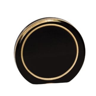 Black circular lid with a gold edge on a white background