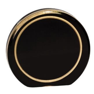 Close-up of a black circular disc with a shiny gold ring around the edge.
