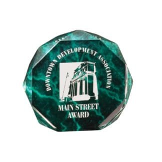 Teal faceted award featuring a line drawing of a building and the words 'Downtown Development Association Main Street Award'.