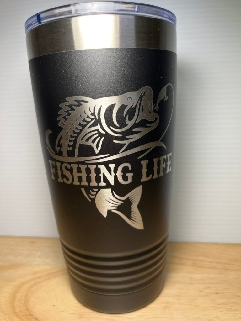 Black insulated tumbler with a silver fish graphic and the text 'FISHING LIFE' along the side, and a clear blue-tinted lid.