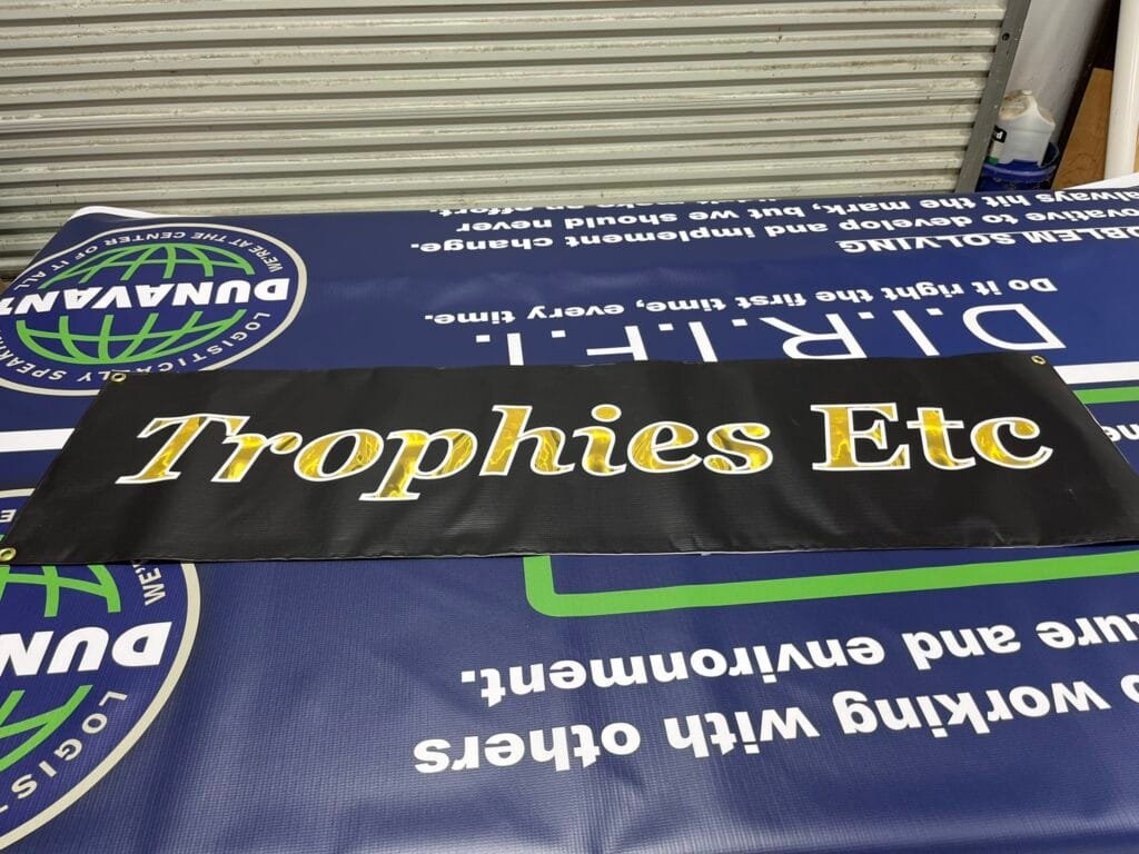 Custom vinyl banners printed for commercial businesses and events by Trophies Etc. in Baytown, TX.