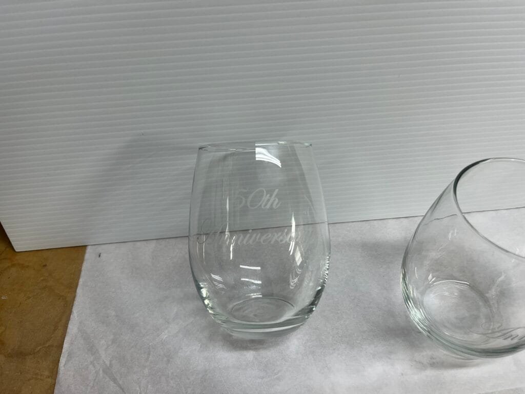 Personalized engraved 50th anniversary stemless wine glasses custom engraved by Trophies Etc. in Baytown, TX.