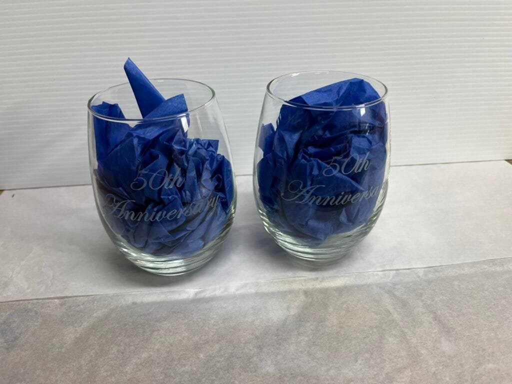 Custom sand carved 50th anniversary wine glasses personalized engraving by Trophies Etc. in Baytown, TX.